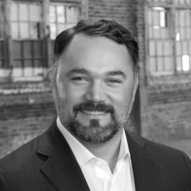 A black and white photo of the Vice President of Leasing & Acquisitions at LDK Ventures, Jason Klier.