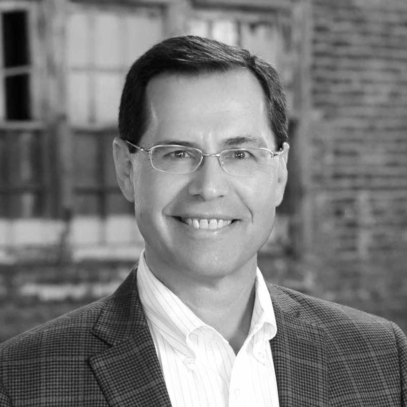 A black and white photo of the Principal and General Counsel for LDK Ventures, Jay Heckenlively.