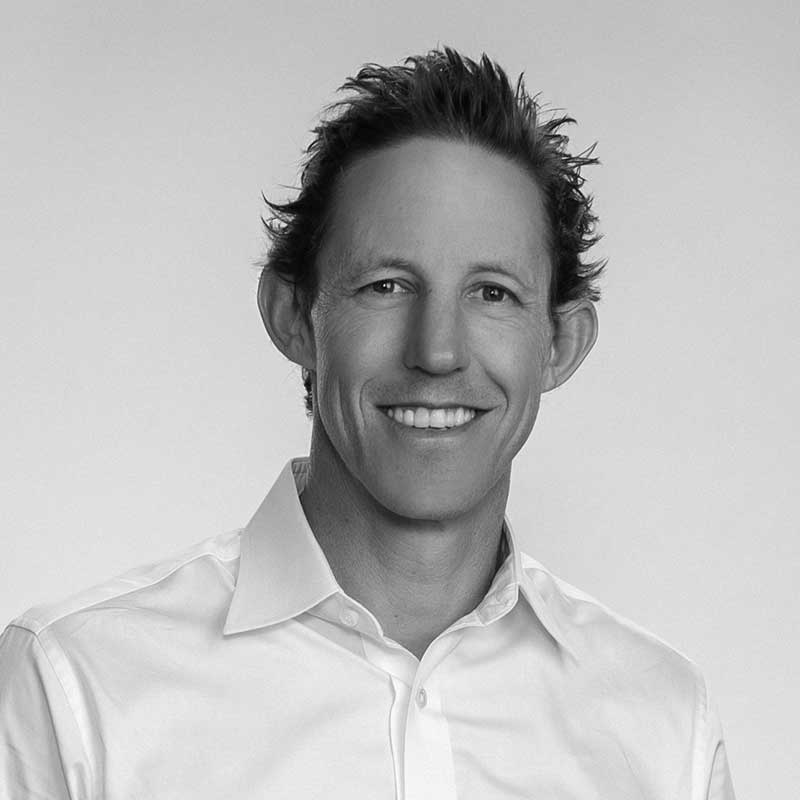 A black and white photo of the Senior Vice President of Project Development at LDK Ventures, Josh Leachman.