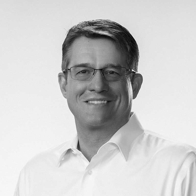 A black and white photo of Senior Vice President of Commercial Development for LDK Ventures, Trey Gundlach.