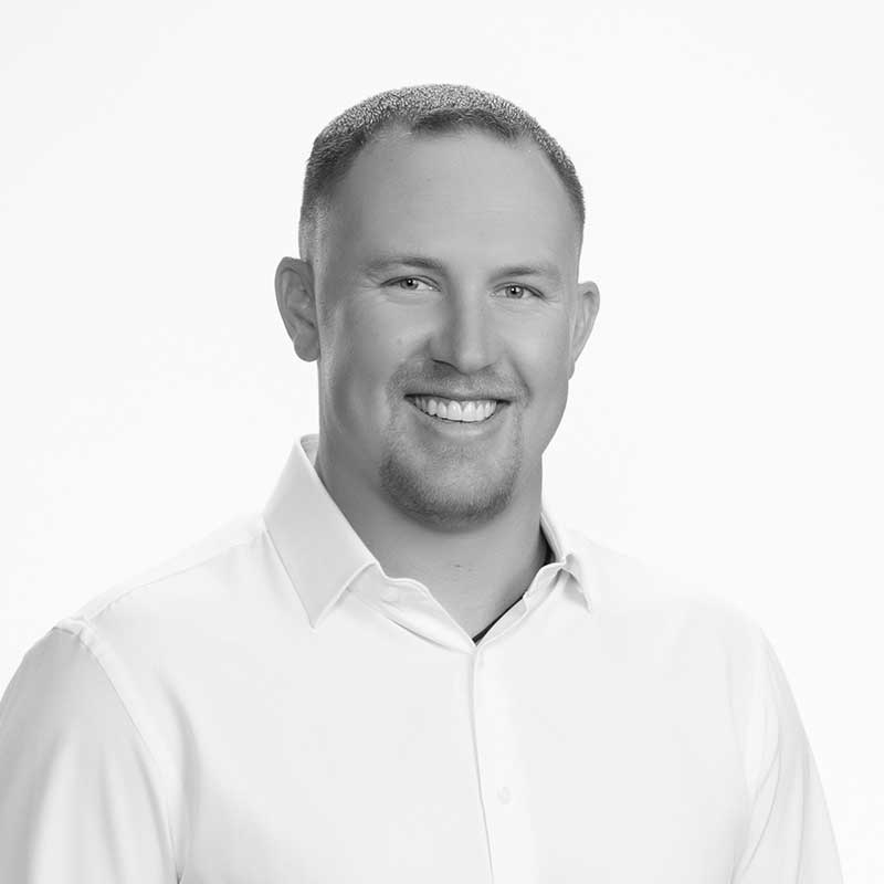 A black and white photo of the Walker Durant, th Regional Vice President - Southwest Division.