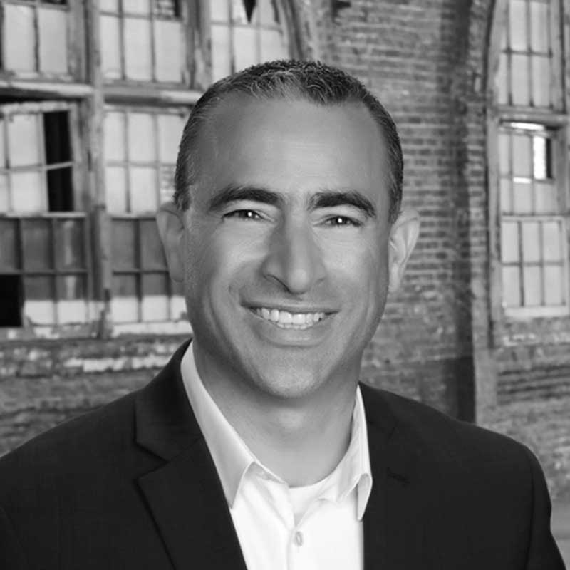 A black and white photo of the Senior VP of Property Management at LDK Ventures, David Mastro.